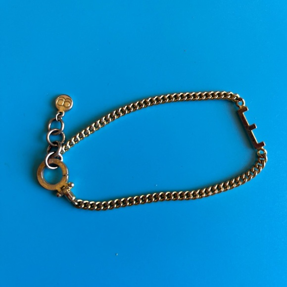 Gojana gold tone E bracelet